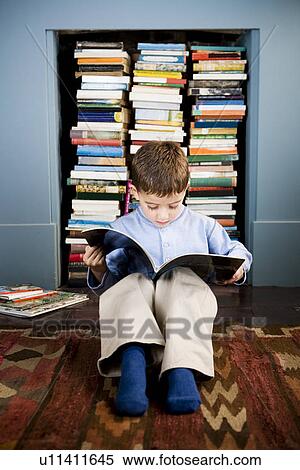 little boy sitting on the floor reading View Large Photo Image Stock Photography - little boy sitting on the floor reading. Fotosearch