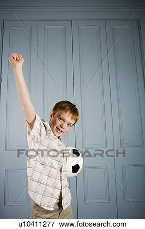 little boy stretching arm up in victory View Large Photo Image Stock Photo - little boy stretching arm up in victory. Fotosearch