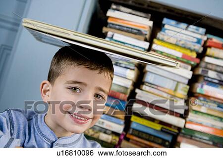 little boy with book balanced on his head View Large Photo Image Stock Photograph - little boy with book balanced on his head. Fotosearch
