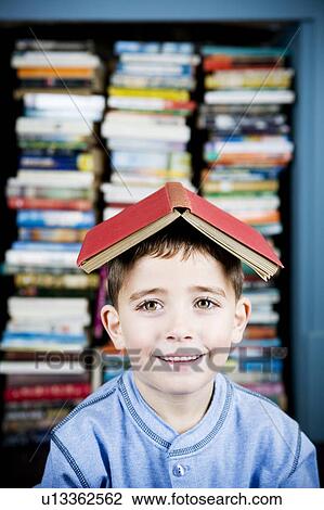 little boy with book on his head View Large Photo Image Stock Image - little boy with book on his head. Fotosearch