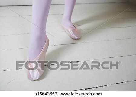 Stock Photo - Close up of a girl in ballet shoes. Fotosearch