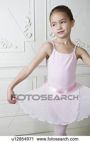 Little girl in a ballet pose View Large Photo Image Stock Image - Little girl in a ballet pose . Fotosearch