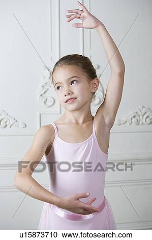 Stock Image - Little girl in a ballet pose . Fotosearch