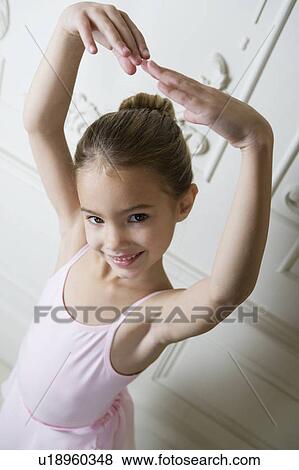Stock Photo - Little girl in a ballet pose . Fotosearch