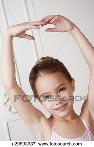 Little girl in a ballet pose View Large Photo Image Stock Photo - Little girl in a ballet pose . Fotosearch
