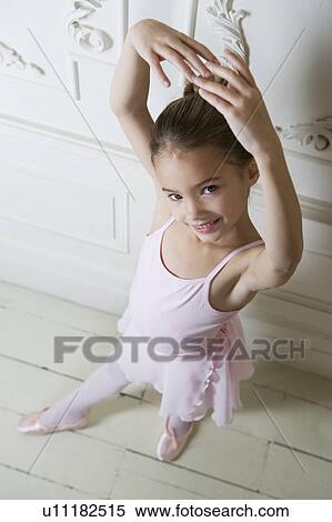 Stock Photography - Little girl in a ballet pose . Fotosearch