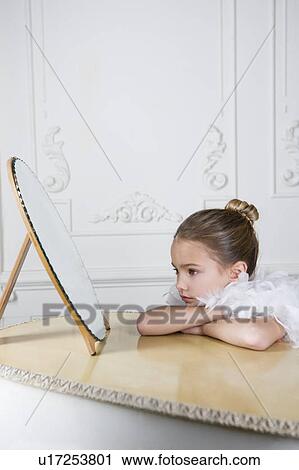 Portrait of a young girl with a feather boa in dressing up clothes View Large Photo Image Stock Image - Portrait of a young girl with a feather boa in dressing up clothes. Fotosearch