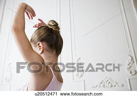 Young girl in a ballet pose View Large Photo Image Stock Image - Young girl in a ballet pose. Fotosearch