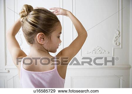Young girl performing a ballet move View Large Photo Image Stock Photo - Young girl performing a ballet move . Fotosearch