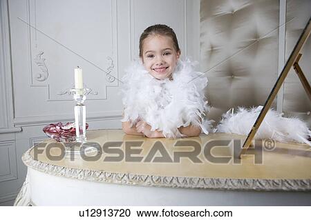 Young girl playing at dressing up View Large Photo Image Stock Image - Young girl playing at dressing up . Fotosearch