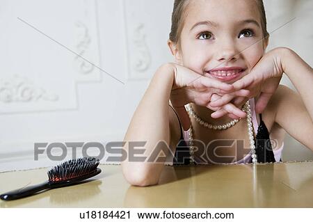 Young girl playing at dressing up View Large Photo Image Stock Image - Young girl playing at dressing up . Fotosearch