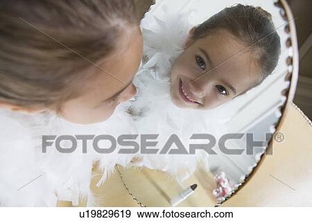 Young girl playing at dressing up View Large Photo Image Stock Photo - Young girl playing at dressing up . Fotosearch
