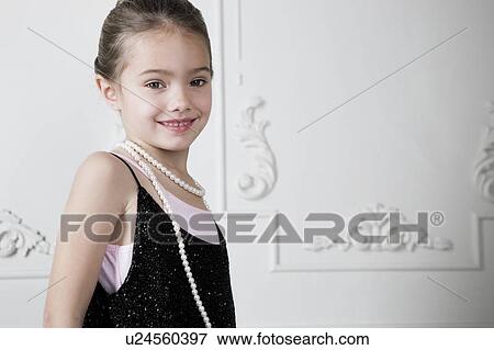Young girl playing at dressing up View Large Photo Image Stock Photo - Young girl playing at dressing up . Fotosearch