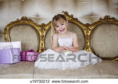 Little girl holding birthday present View Large Photo Image Stock Image - Little girl holding birthday present . Fotosearch