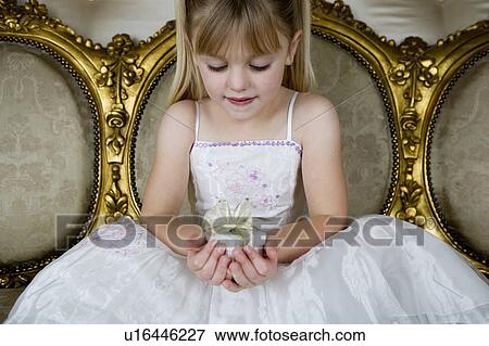 Little girl holding birthday present View Large Photo Image Stock Photo - Little girl holding birthday present . Fotosearch