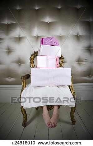 Little girl in a party dress holding a stack of birthday presents View Large Photo Image Stock Image - Little girl in a party dress holding a stack of birthday presents. Fotosearch