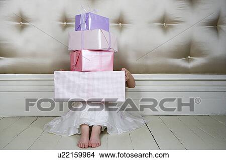 Little girl with birthday presents View Large Photo Image Picture - Little girl with birthday presents . Fotosearch