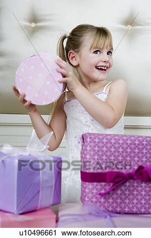 Little girl with birthday presents View Large Photo Image Stock Image - Little girl with birthday presents . Fotosearch