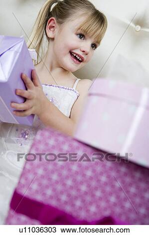Little girl with birthday presents View Large Photo Image Stock Image - Little girl with birthday presents . Fotosearch