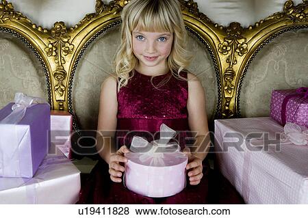 Little girl with birthday presents View Large Photo Image Stock Photo - Little girl with birthday presents . Fotosearch