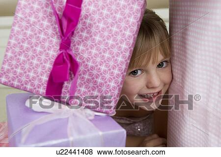 Little girl with birthday presents View Large Photo Image Stock Photo - Little girl with birthday presents . Fotosearch