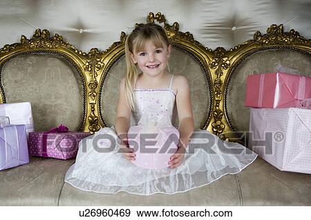 Little girl with birthday presents View Large Photo Image Stock Photo - Little girl with birthday presents. Fotosearch