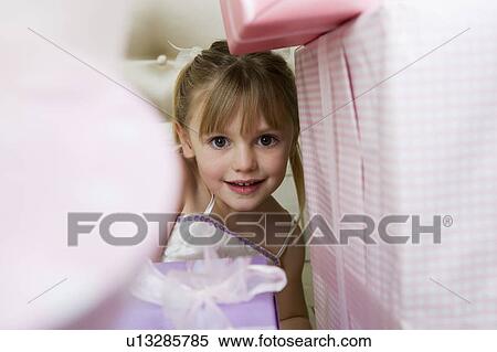 Little girl with birthday presents View Large Photo Image Stock Photography - Little girl with birthday presents . Fotosearch
