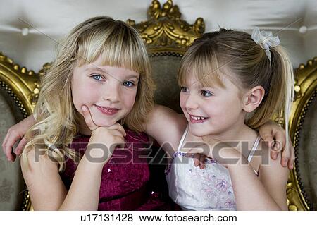 Two friends in party dresses View Large Photo Image Stock Photo - Two friends in party dresses . Fotosearch