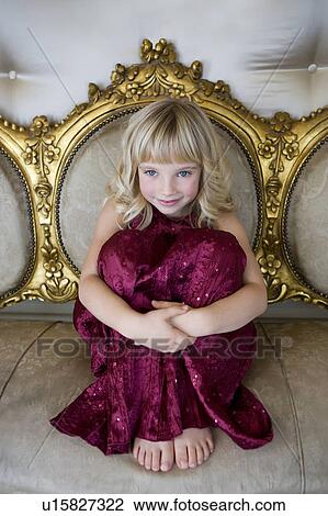 Portrait of a young girl smiling and wearing a party dress View Large Photo Image Stock Image - Portrait of a young girl smiling and wearing a party dress. Fotosearch