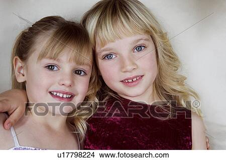 Picture - Two friends in party dresses . Fotosearch