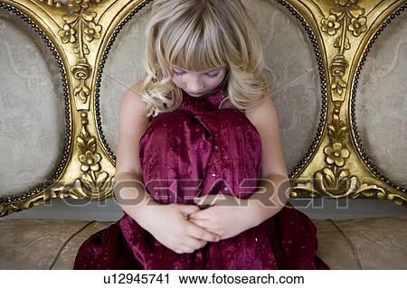 Young girl in a party dress crying or sulking View Large Photo Image Stock Image - Young girl in a party dress crying or sulking. Fotosearch