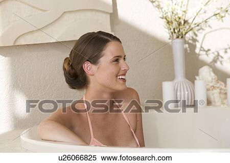A young woman in a bath View Large Photo Image Stock Photography - A young woman in a bath. Fotosearch