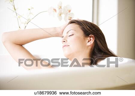 A young woman in the bath, close-up View Large Photo Image Stock Photograph - A young woman in the bath, close-up. Fotosearch