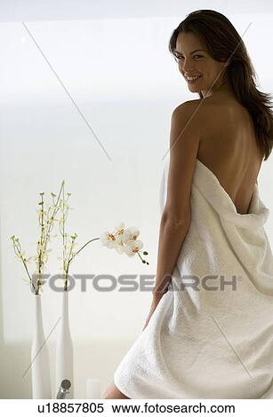A young woman wrapped in a bath towel View Large Photo Image Stock Photography - A young woman wrapped in a bath towel. Fotosearch