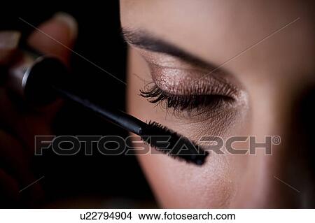 Woman applying mascara View Large Photo Image Picture - Woman applying mascara. Fotosearch