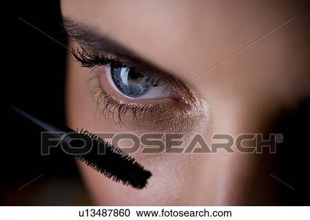 Woman applying mascara View Large Photo Image Stock Image - Woman applying mascara. Fotosearch