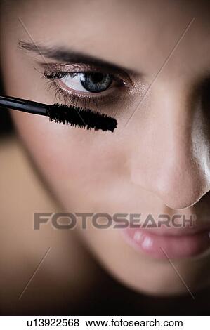Woman applying mascara View Large Photo Image Stock Photo - Woman applying mascara. Fotosearch
