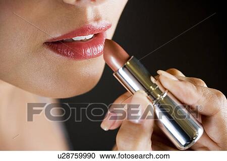 Woman applying red lipstick, close-up of mouth View Large Photo Image Stock Image - Woman applying red lipstick, close-up of mouth. Fotosearch