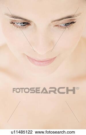 Close-up of young woman's face View Large Photo Image Stock Image - Close-up of young woman's face. Fotosearch