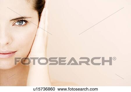 Cropped portrait of young woman's face with hand over her ear, hear no evil View Large Photo Image Stock Image - Cropped portrait of young woman's face with hand over her ear, hear no evil. Fotosearch