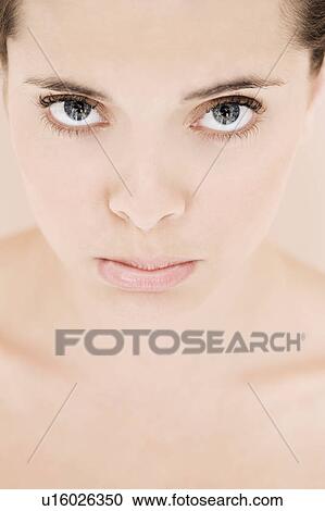 Portrait of young woman looking fed-up View Large Photo Image Stock Image - Portrait of young woman looking fed-up. Fotosearch
