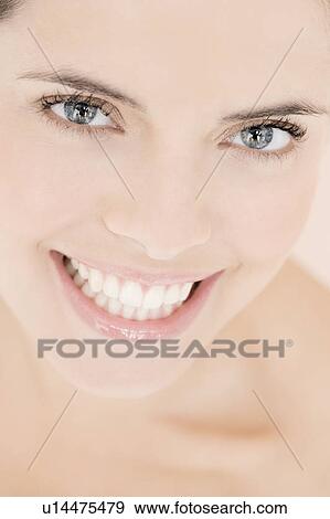 Portrait of young woman smiling View Large Photo Image Stock Photo - Portrait of young woman smiling. Fotosearch