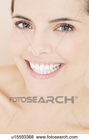 Portrait of young woman smiling View Large Photo Image Stock Photo - Portrait of young woman smiling. Fotosearch