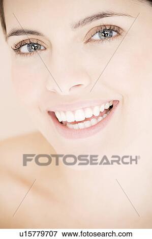 Portrait of young woman smiling View Large Photo Image Stock Photo - Portrait of young woman smiling. Fotosearch