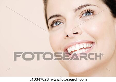 Portrait of young woman smiling View Large Photo Image Stock Photograph - Portrait of young woman smiling. Fotosearch