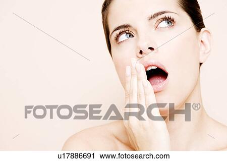 Portrait of young woman yawning View Large Photo Image Stock Image - Portrait of young woman yawning. Fotosearch