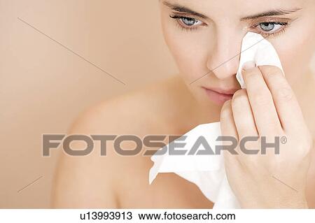 Woman crying, wiping tears away with a tissue View Large Photo Image Stock Image - Woman crying, wiping tears away with a tissue. Fotosearch
