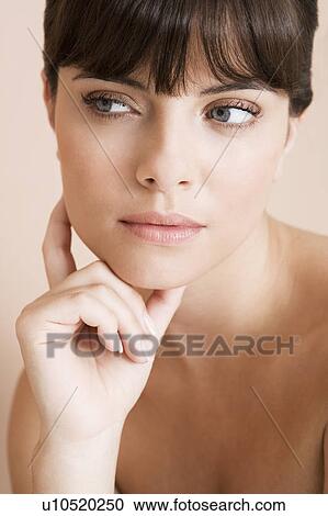 Young woman looking pensive, thinking View Large Photo Image Stock Image - Young woman looking pensive, thinking. Fotosearch
