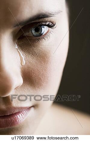 Stock Photo - Close up of woman crying. Fotosearch