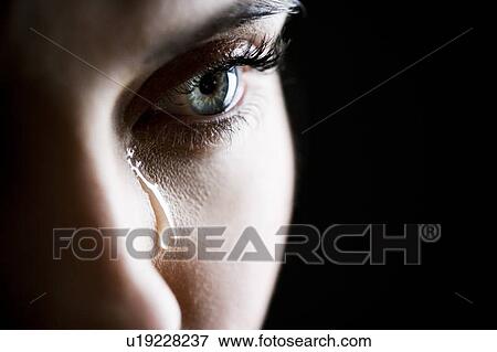 Stock Photo - Close up of woman crying. Fotosearch